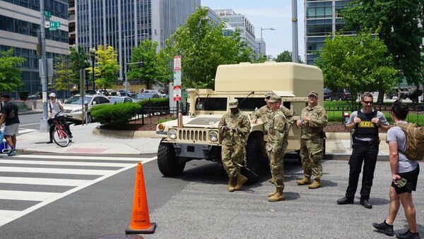 US National Guard personnel stand by a service vehicle during a demonstration against police brutality in Washington DC, US, 06.06.2020. - Sputnik International
