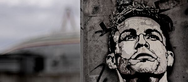 The image of Cristiano Ronaldo is painted on a mural outside the Juventus Stadium in Turin, Italy, Tuesday, May 19, 2020. Cristiano Ronaldo has reported back to Juventus’ training center after a 10-week absence. The five-time Ballon d’Or winner showed up for medical tests with the Serie A leader Tuesday, May 19, 2020 - Sputnik International