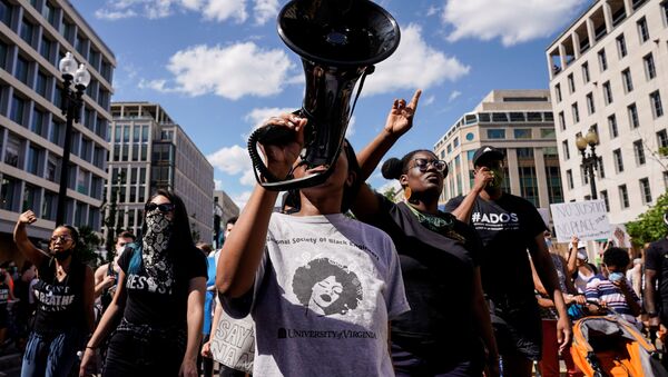 Protesters march against the death in Minneapolis police custody of George Floyd, near the White House in Washington, U.S., June 7, 2020.   - Sputnik International