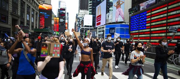 Protesters chant during a solidarity march for George Floyd down Times Square, Tuesday, June 2, 2020, in the Manhattan borough of New York Protesters chant during a solidarity march for George Floyd down Times Square, Tuesday, June 2, 2020, in the Manhattan borough of New York - Sputnik International