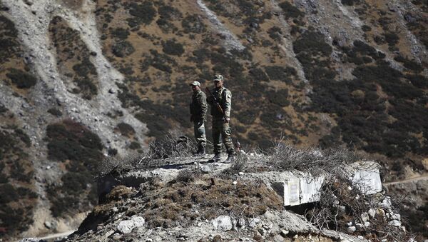 Indian army soldiers keep watch on a bunker at the Indo China border in Bumla at an altitude of 15,700 feet (4,700 meters) above sea level in Arunachal Pradesh, India, Sunday, Oct. 21, 2012 - Sputnik International