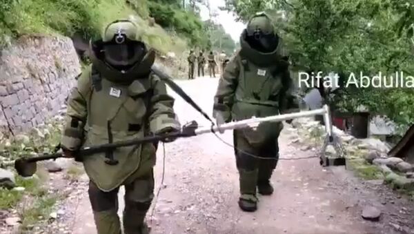 Another Video from Uri Baramulla.  Bomb Disposal Squad detonating unexploded RP Shell - Sputnik International