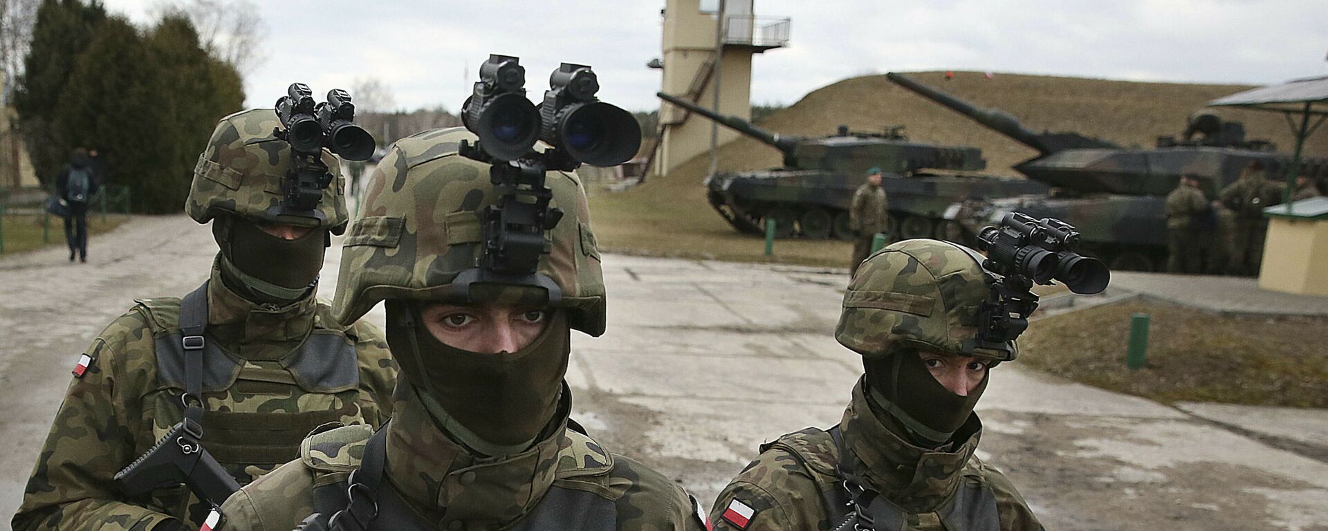 In this photo taken March 10, 2019, in Wesola,near Warsaw, central Poland, are seen Polish troops in combat gear during brief exercise with some other NATO forces marking 20 years since Poland, the Czech Republic and Hungary joined the Western military alliance - Sputnik International, 1920, 25.01.2022