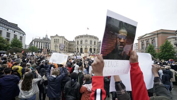 People take part in a demonstration called We can't breathe - justice for George Floyd outside the Parliament Building, in Oslo, Norway June 5, 2020.  - Sputnik International