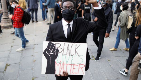 Malcom Biiga, a 26 year-old French civil servant poses as he attends a protest against police violence and racial inequality in the aftermath of the death in police custody of George Floyd, near the U.S. Embassy in Paris, France June 6, 2020. Picture taken June 6, 2020 - Sputnik International