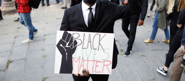 Malcom Biiga, a 26 year-old French civil servant poses as he attends a protest against police violence and racial inequality in the aftermath of the death in police custody of George Floyd, near the U.S. Embassy in Paris, France June 6, 2020. Picture taken June 6, 2020 - Sputnik International