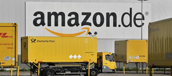 FILE - In this file photo dated Wednesday, Nov. 14, 2018, post trucks leave the Amazon Logistic Center in Rheinberg, Germany - Sputnik International