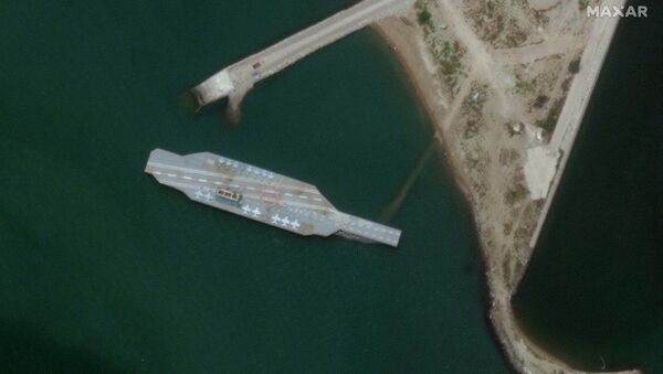 In this Sunday, June 7, 2020 satellite photo provided by Maxar Technologies, a fake aircraft carrier is seen off the coast of Bandar Abbas, Iran. - Sputnik International