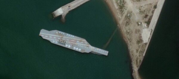 In this Sunday, June 7, 2020 satellite photo provided by Maxar Technologies, a fake aircraft carrier is seen off the coast of Bandar Abbas, Iran. In this Sunday, June 7, 2020 satellite photo provided by Maxar Technologies, a fake aircraft carrier is seen off the coast of Bandar Abbas, Iran. - Sputnik International