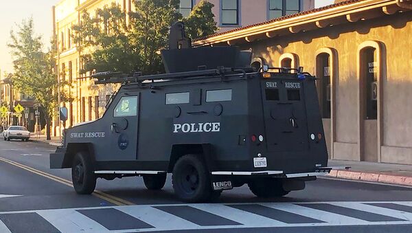 In this image taken from video and provided by KSBY-TV, an armored vehicle patrols the streets of Paso Robles in California's Central Coast region after a sheriff's deputy was wounded after someone opened fire on a police station early Wednesday, June 10, 2020.  - Sputnik International