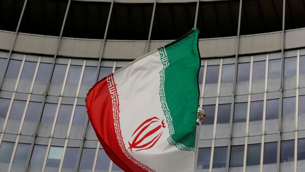 An Iranian flag flutters in front of the International Atomic Energy Agency (IAEA) headquarters in Vienna, Austria, September 9, 2019.   - Sputnik International