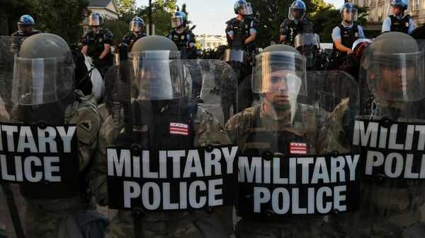 FILE PHOTO: DC National Guard Military Police officers and law enforcement officers stand guard during a protest against the death in Minneapolis custody of George Floyd, near the White House in Washington, D.C., U.S., 1 June 2020. REUTERS/Jonathan Ernst/File Photo - Sputnik International