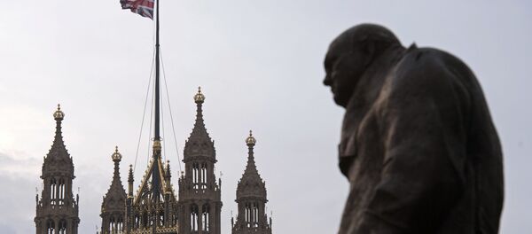 A statue of former British Prime Minister Winston Churchill stands near the Victoria Tower of the Houses of Parliament, as a British Union flag flies from a pole atop the tower, in London on December 8, 2016. A statue of former British Prime Minister Winston Churchill stands near the Victoria Tower of the Houses of Parliament, as a British Union flag flies from a pole atop the tower, in London on December 8, 2016. - Sputnik International