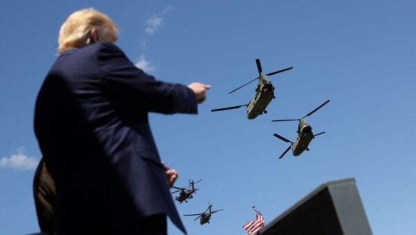 U.S. President Donald Trump points at West Point graduating cadets as U.S. Army helicopters fly overhead at the culmination of the 2020 United States Military Academy Graduation Ceremony at West Point, New York, U.S., June 13, 2020. - Sputnik International