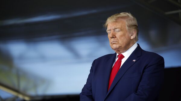 President Donald Trump prays during a commencement ceremony on the parade field, at the United States Military Academy in West Point, N.Y., Saturday, June 13, 2020 - Sputnik International