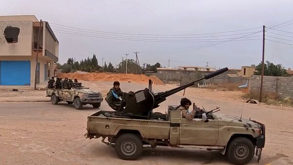  Fighters loyal to Haftar on a road south of the capital Tripoli - Sputnik International