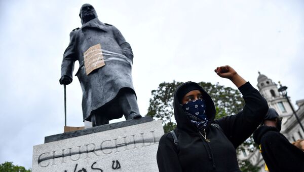 FILE PHOTO: A demonstrator reacts infront of graffiti on a statue of Winston Churchill in Parliament Square during a Black Lives Matter protest in London, following the death of George Floyd who died in police custody in Minneapolis, London, Britain, June 7, 2020.  - Sputnik International