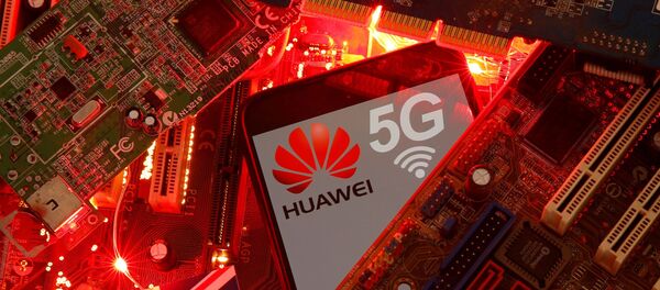 The British flag and a smartphone with a Huawei and 5G network logo are seen on a PC motherboard in this illustration picture taken 29 January 2020. - Sputnik International