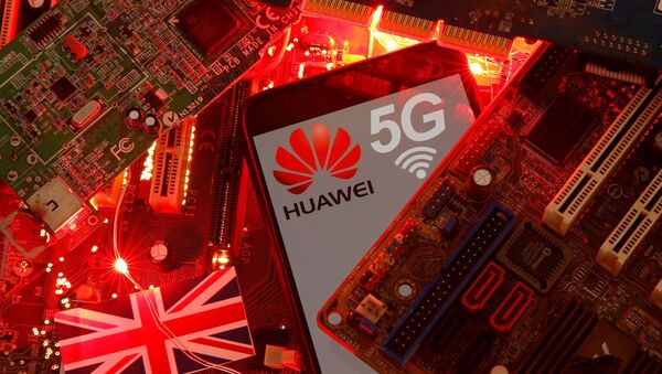 The British flag and a smartphone with a Huawei and 5G network logo are seen on a PC motherboard in this illustration picture taken 29 January 2020. - Sputnik International
