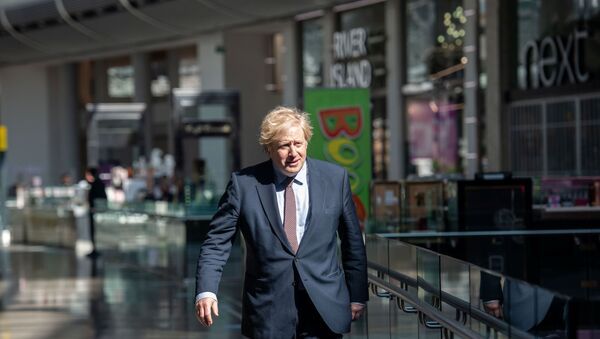 Prime Minister Boris Johnson visits the M&S clothing department and other retail outlets in Westfield Stratford to see the COVID-19 measure taken before reopening tomorrow, in London, Britain June 14, 2020. - Sputnik International