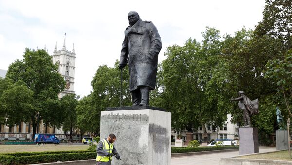 A council employee cleans graffiti from the statue of Winston Churchill at Parliament Square, in the aftermath of protests against the death of George Floyd who died in police custody in Minneapolis, London, Britain, June 8, 2020.  - Sputnik International
