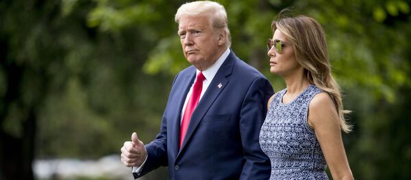 President Donald Trump and first lady Melania Trump walk across the South Lawn of the White House in Washington, Wednesday, May 27, 2020 - Sputnik International