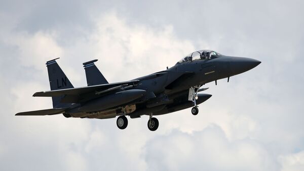 A US Air Force (USAF) F-15E Eagle fighter jet, is pictured as it prepares to land at RAF (Royal Air Force) Lakenheath, east of England, on June 15, 2020. - Sputnik International
