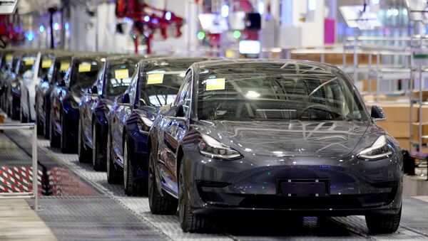 FILE PHOTO: Tesla China-made Model 3 vehicles are seen during a delivery event at its factory in Shanghai - Sputnik International