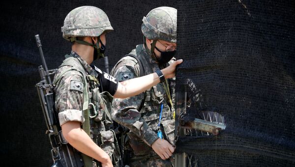 South Korean soldiers check an entrance of their guard post near the demilitarized zone separating the two Koreas in Paju, South Korea, June 16, 2020 - Sputnik International