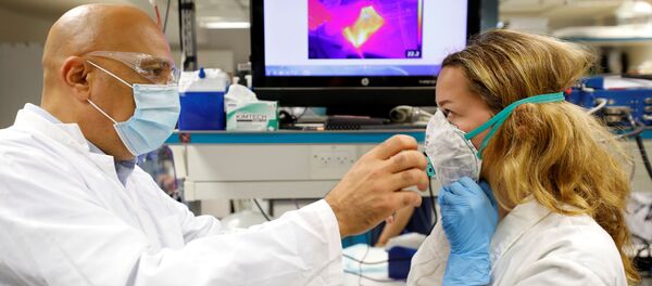 Israeli Professor Yair Ein-Eli, who led the research team which say they have invented a reusable face mask that can disinfect itself and kill the coronavirus disease (COVID-19), takes part in a demonstration for Reuters at a laboratory in Haifa, northern Israel June 10, 2020 Israeli Professor Yair Ein-Eli, who led the research team which say they have invented a reusable face mask that can disinfect itself and kill the coronavirus disease (COVID-19), takes part in a demonstration for Reuters at a laboratory in Haifa, northern Israel June 10, 2020 - Sputnik International
