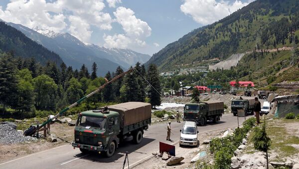 Indian army trucks move along a highway leading to Ladakh, at Gagangeer in Kashmir's Ganderbal district June 17, 2020 - Sputnik International