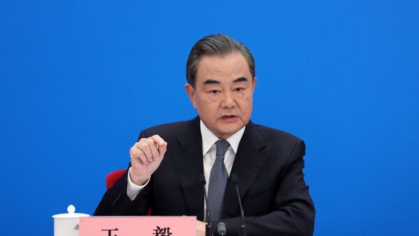 Chinese State Councillor and Foreign Minister Wang Yi speaks to reporters via video link at a news conference held on the sidelines of the National People's Congress (NPC), from the Great Hall of the People in Beijing, China May 24, 2020. - Sputnik International