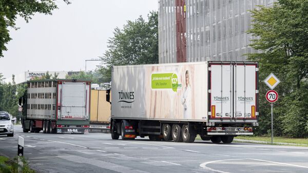 Trucks leave the Toennies meatpacking plant in Rheda-Wiedenbrueck, Germany, Wednesday, June 17, 2020 - Sputnik International