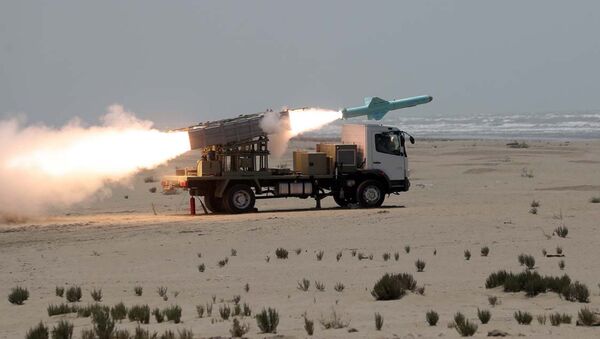 This picture made available by the Iranian armed forces office on 18 June 2020 shows a missile being fired out to sea from a mobile launch vehicle reportedly on the southern coast of Iran along the Gulf of Oman during a military exercise.  - Sputnik International