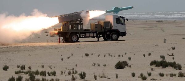 This picture made available by the Iranian armed forces office on 18 June 2020 shows a missile being fired out to sea from a mobile launch vehicle reportedly on the southern coast of Iran along the Gulf of Oman during a military exercise.  - Sputnik International
