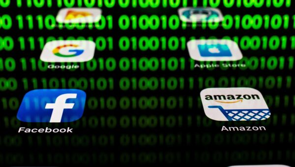 This illustration picture taken on April 20, 2018 in Paris shows apps for Google, Amazon, Facebook, Apple (GAFA) and the reflexion of a binary code displayed on a tablet screen - Sputnik International