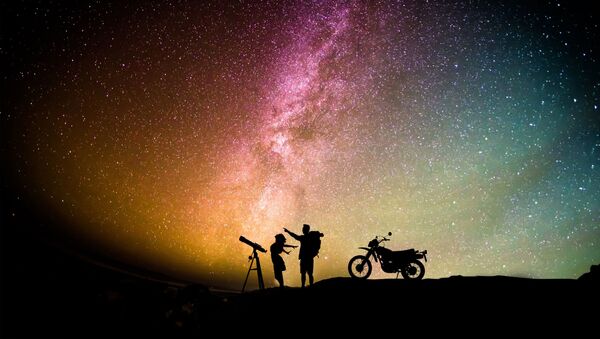 Woman standing between telescope with stand and motorcycle - Sputnik International