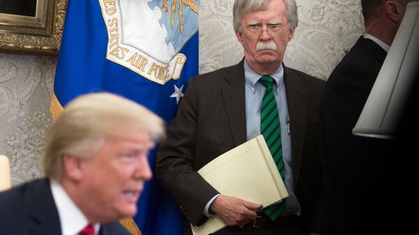  In this file photo National Security Adviser John Bolton stands alongside US President Donald Trump as he speaks during a meeting with NATO Secretary General Jens Stoltenberg in the Oval Office of the White House in Washington, DC, May 17, 2018. - The US Justice Department filed an emergency order Wednesday seeking to halt release of ex-national security advisor John Bolton's book, the second time in two days that President Donald Trump tried to block the tell-all memoir.  - Sputnik International