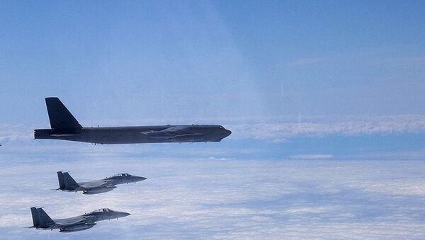 A B-52H Stratofortress deployed from Barksdale Air Force Base, La., flies alongside two Japan Air Self-Defense Force F-15s over the Sea of Japan while conducting a Bomber Task Force mission June 16, 2020. Bomber Task Force missions help maintain global stability and security while enabling units to become familiar with operations in different regions - Sputnik International
