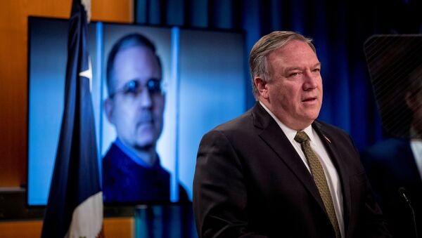 An image of Paul Whelan, a former U.S. marine who was arrested for alleged spying in Moscow, is displayed behind Secretary of State Mike Pompeo, as he speaks during  a news conference at the State Department in Washington, DC, U.S., June 10, 2020 - Sputnik International