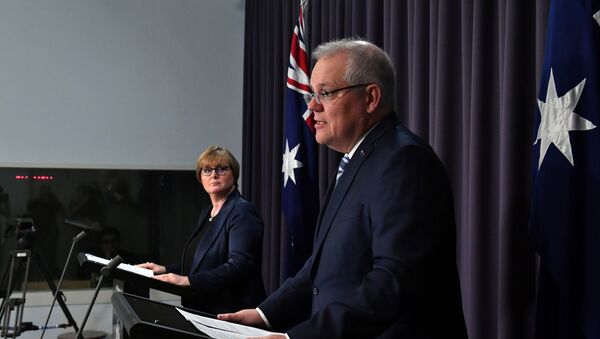 Prime Minister Scott Morrison speaks as Minister for Defence Linda Reynolds looks on during a press conference, revealing a state-based cyber attack targeting Australian government and business, at Parliament House in Canberra, Australia, 19 June 2020. - Sputnik International
