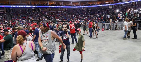 Supporters of U.S. President Donald Trump wait for him to appear, 25 minutes before he was scheduled to speak, at his first re-election campaign rally in several months in the midst of the coronavirus disease (COVID-19) outbreak, at the BOK Center in Tulsa, Oklahoma, U.S., June 20, 2020 - Sputnik International