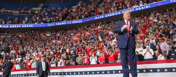 U.S. President Donald Trump reacts to the crowd as he arrives onstage at his first re-election campaign rally in several months in the midst of the coronavirus disease (COVID-19) outbreak, at the BOK Center in Tulsa, Oklahoma, U.S., June 20, 2020. - Sputnik International