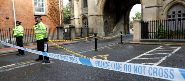 Police officers stand behind the cordon at the scene of multiple stabbings in Reading, Britain, June 21, 2020. Police officers stand behind the cordon at the scene of multiple stabbings in Reading, Britain, June 21, 2020. - Sputnik International