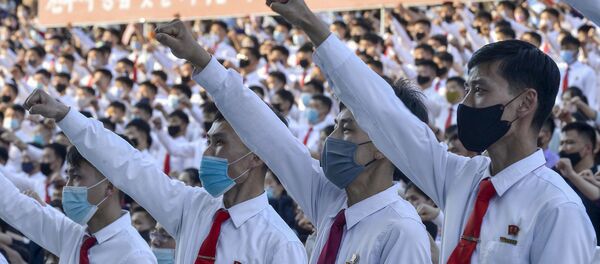 North Korea's youth and students wearing protective face masks hold an outdoor rally in protest of the leaflets launched by defectors in South Korea that condemned the Kim Jong Un's regime in Pyongyang, North Korea, in this photo taken June 6, 2020 and released by Kyodo on June 7, 2020. North Korea's youth and students wearing protective face masks hold an outdoor rally in protest of the leaflets launched by defectors in South Korea that condemned the Kim Jong Un's regime in Pyongyang, North Korea, in this photo taken June 6, 2020 and released by Kyodo on June 7, 2020. - Sputnik International