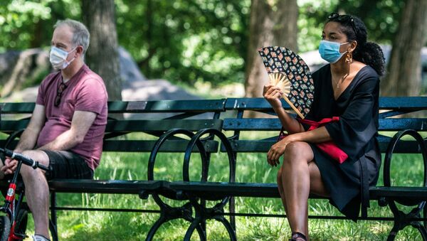 People enjoy the weather in Central Park, the day before the city starts phase two of reopening after the lockdown due to the coronavirus disease (COVID-19), in the Manhattan borough of New York City, U.S., June 21, 2020. - Sputnik International