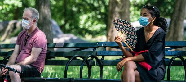 People enjoy the weather in Central Park, the day before the city starts phase two of reopening after the lockdown due to the coronavirus disease (COVID-19), in the Manhattan borough of New York City, U.S., June 21, 2020. - Sputnik International