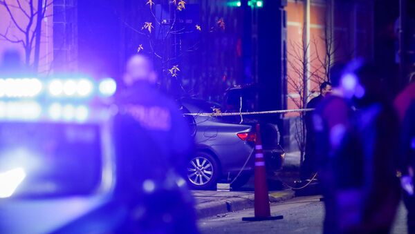 Police officers walk past a car which, according to local media, was crashed by a man into the exterior gate of the Chinese embassy in Buenos Aires, Argentina June 22, 2020. - Sputnik International