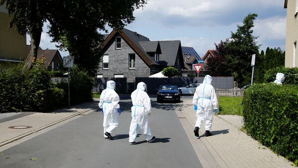 Members of a mobile testing unit of the German Army and German Red Cross arrive to test residents for the coronavirus disease (COVID-19), following an outbreak of the disease at Toennies meat factory, where employees remain under lockdown, in Guetersloh, Germany, June 22, 2020. - Sputnik International