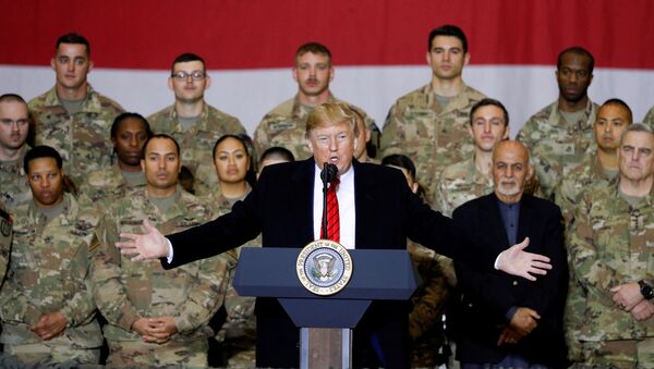 US President Donald Trump delivers remarks to US troops, with Afghanistan President Ashraf Ghani standing behind him, during an unannounced visit to Bagram Air Base, Afghanistan, 28 November 2019 - Sputnik International